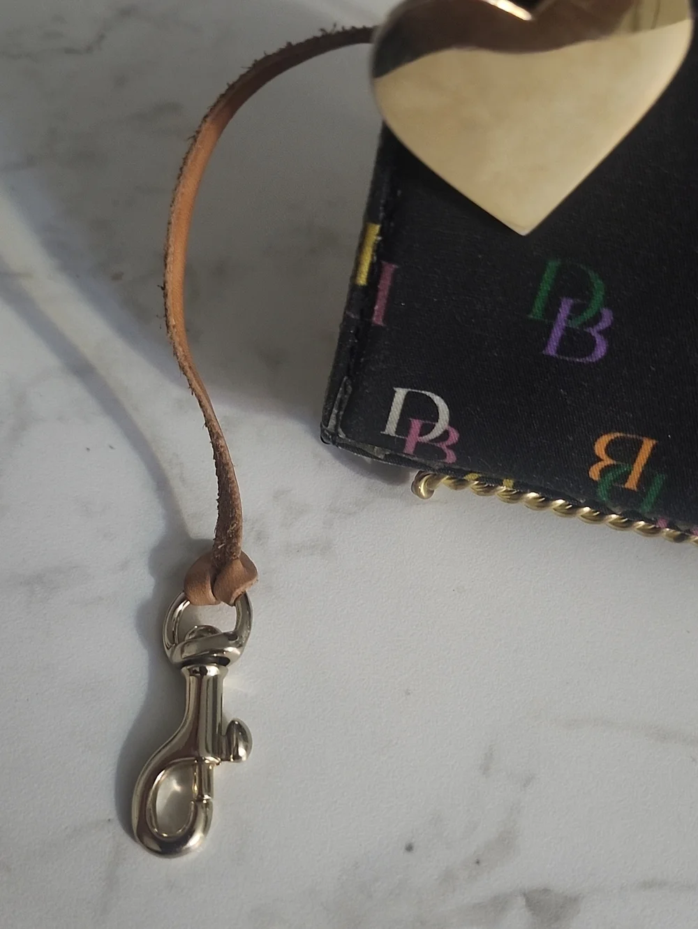 Dooney & Bourke black rainbow monogram wristlet